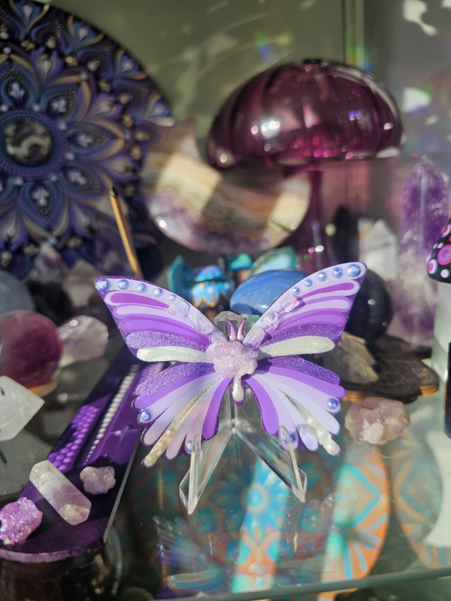 Purple butterfly with crystals.