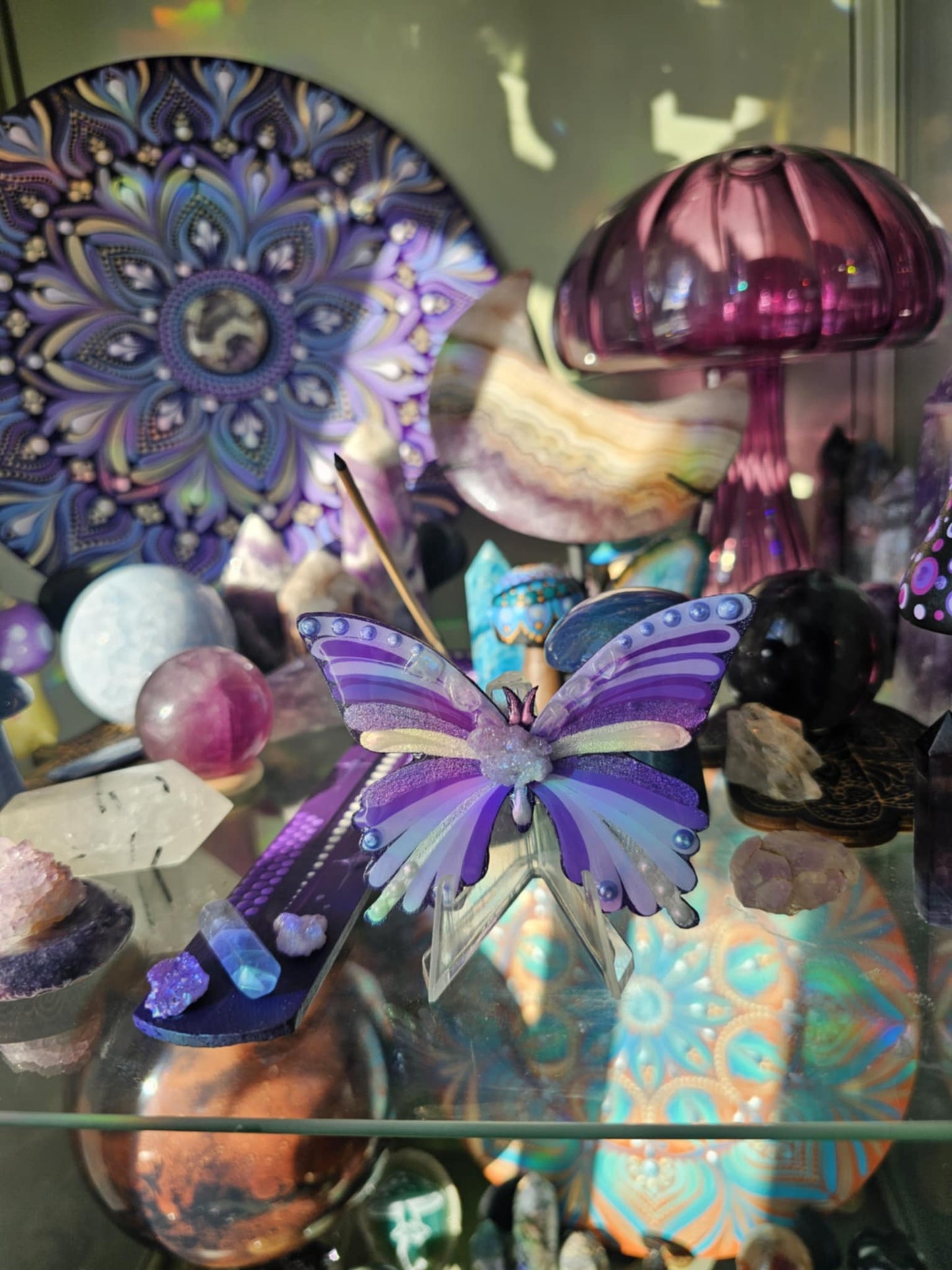 Purple butterfly with crystals.