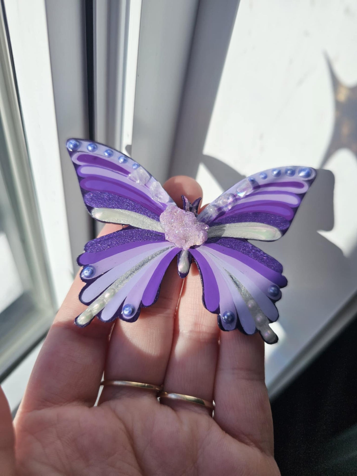 Purple butterfly with crystals.