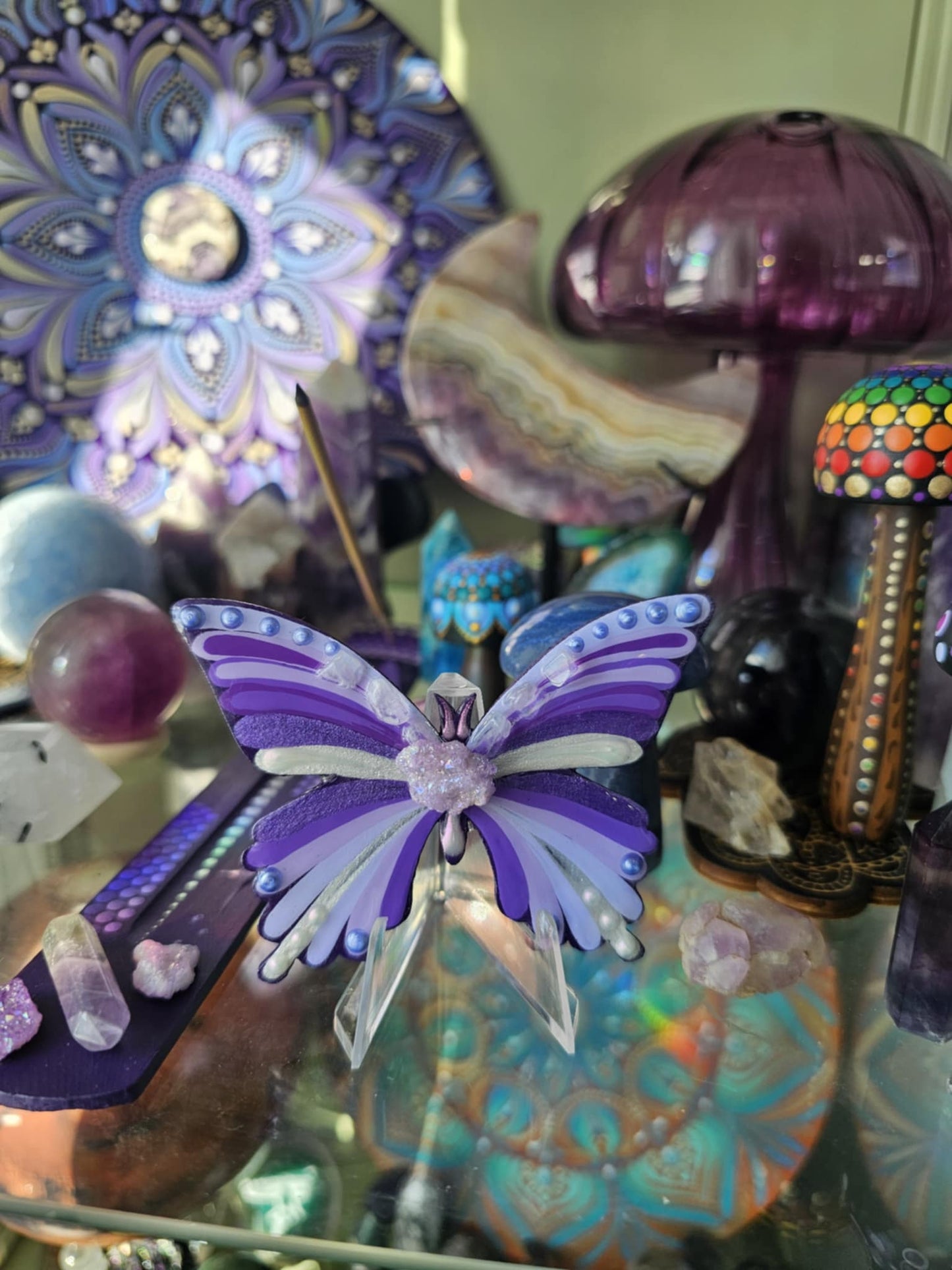 Purple butterfly with crystals.