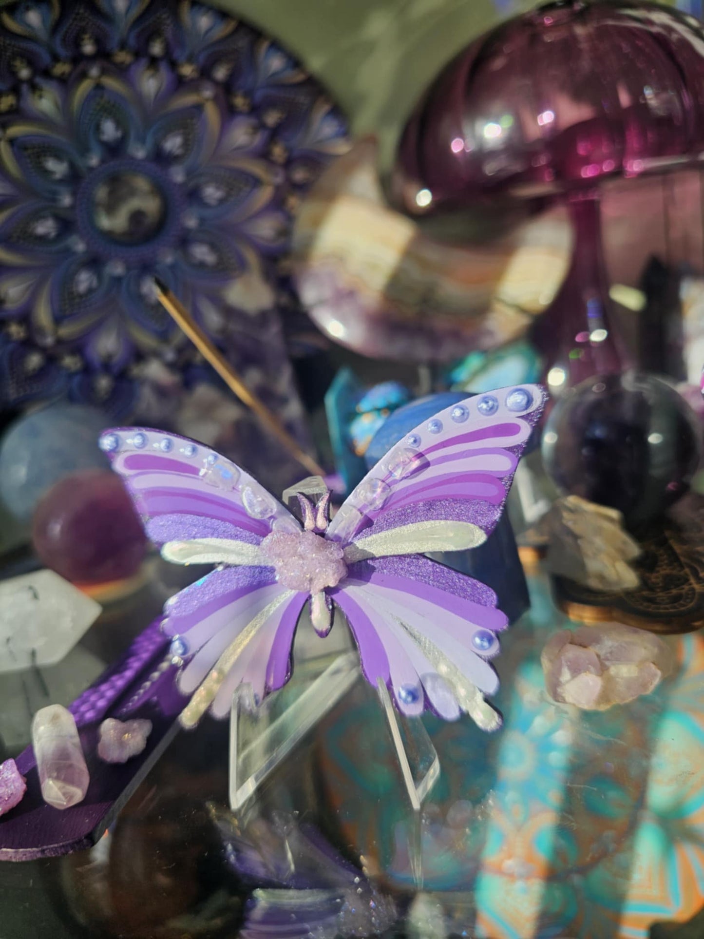 Purple butterfly with crystals.